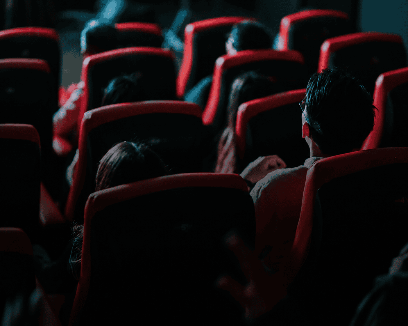 Audience watching a film in a movie theater